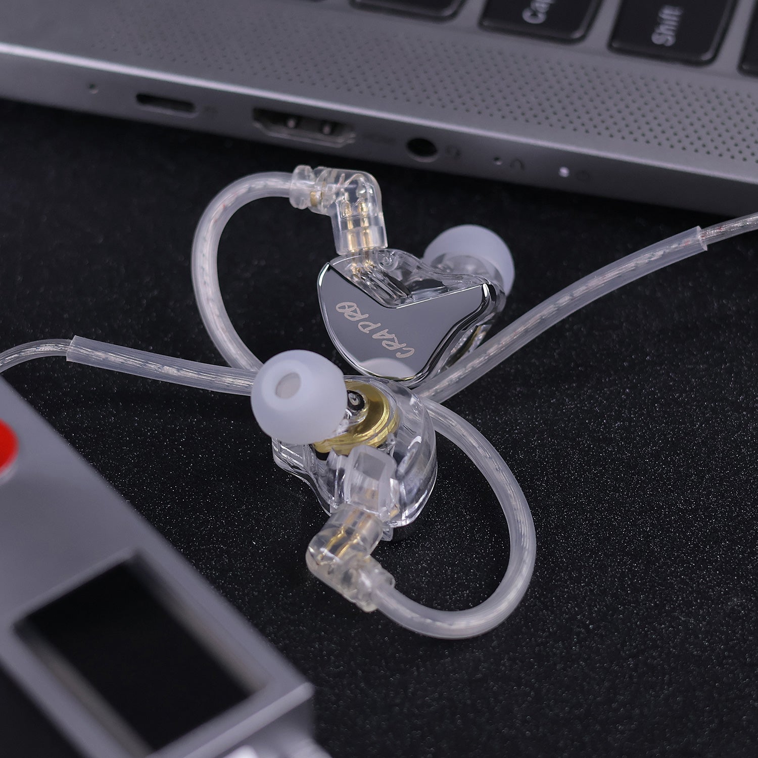 CRA Pro premium earphones polished metallic faceplate close-up
