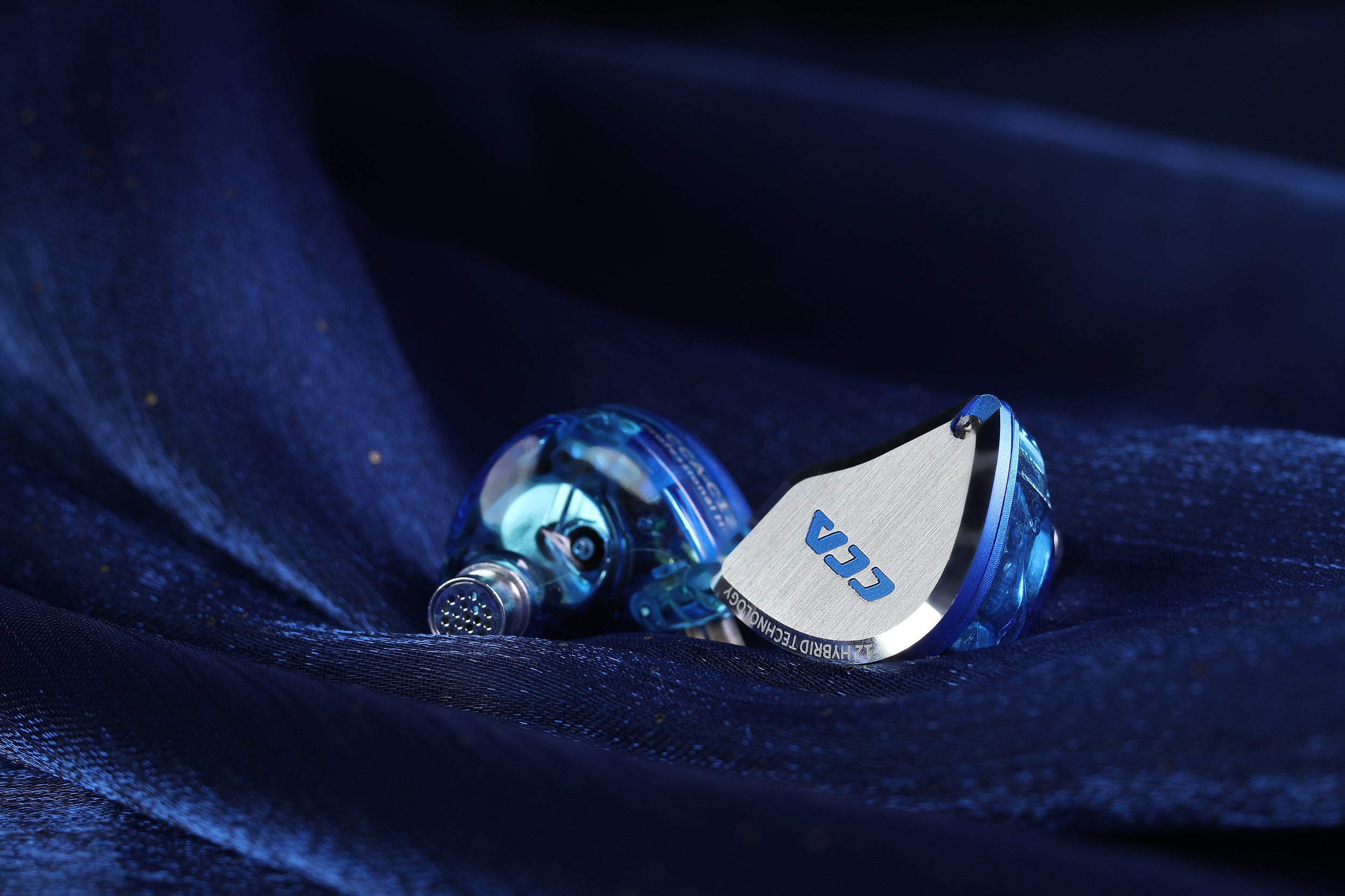 CCA C12 in-ear headphones with sleek metal and resin housing.