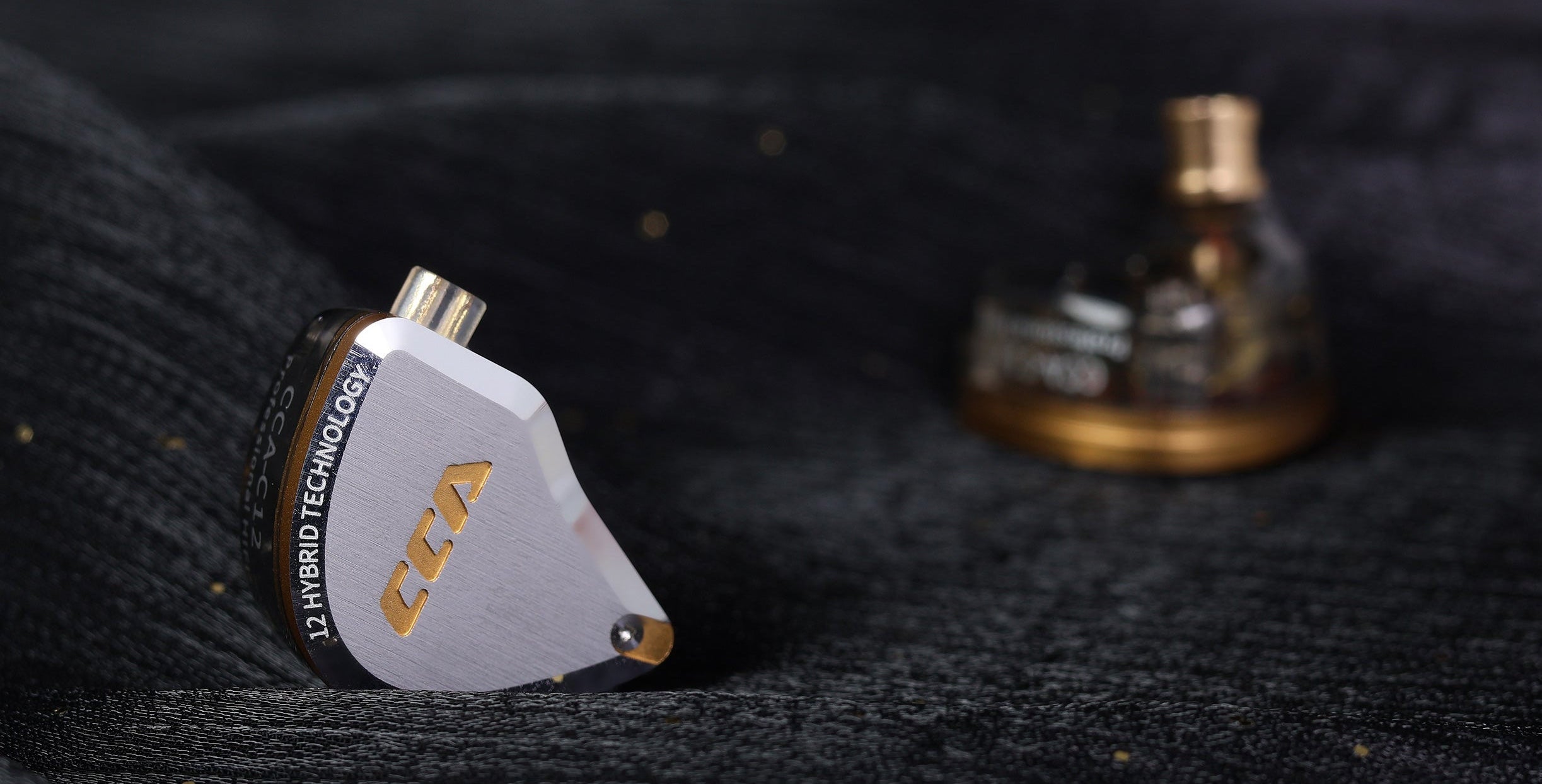CCA C12 IEM showing polished metal exterior and ergonomic design