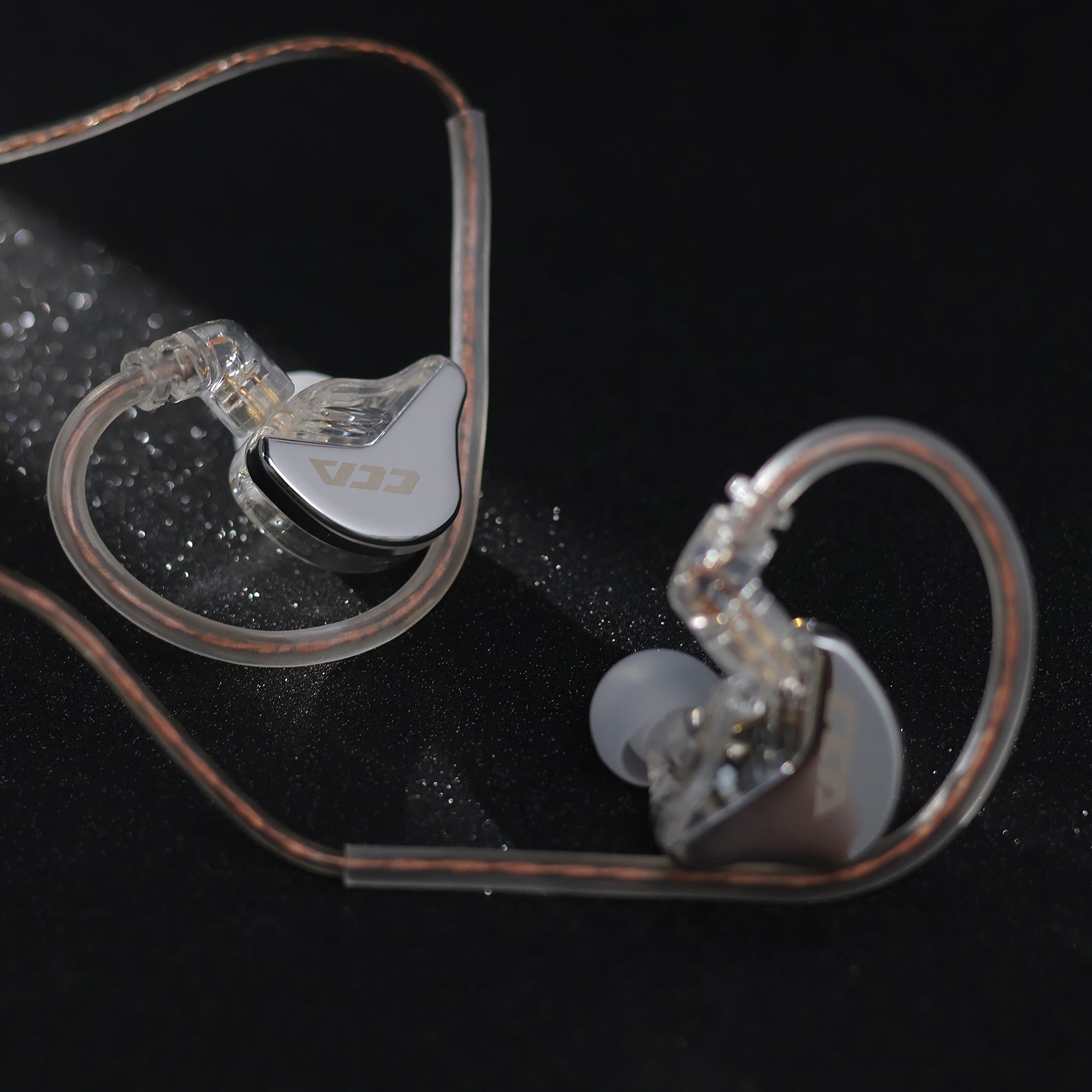 CCA CRA IEM earphones featuring sleek metal housing and clear resin cavity